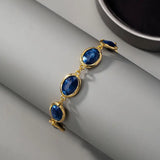 Pulseira Dourada Encantadora de Pedra Azul